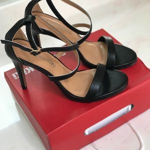 Black open toe high heels in matte